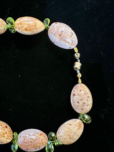 Cyprea Shell Necklace with Peridot Briolettes